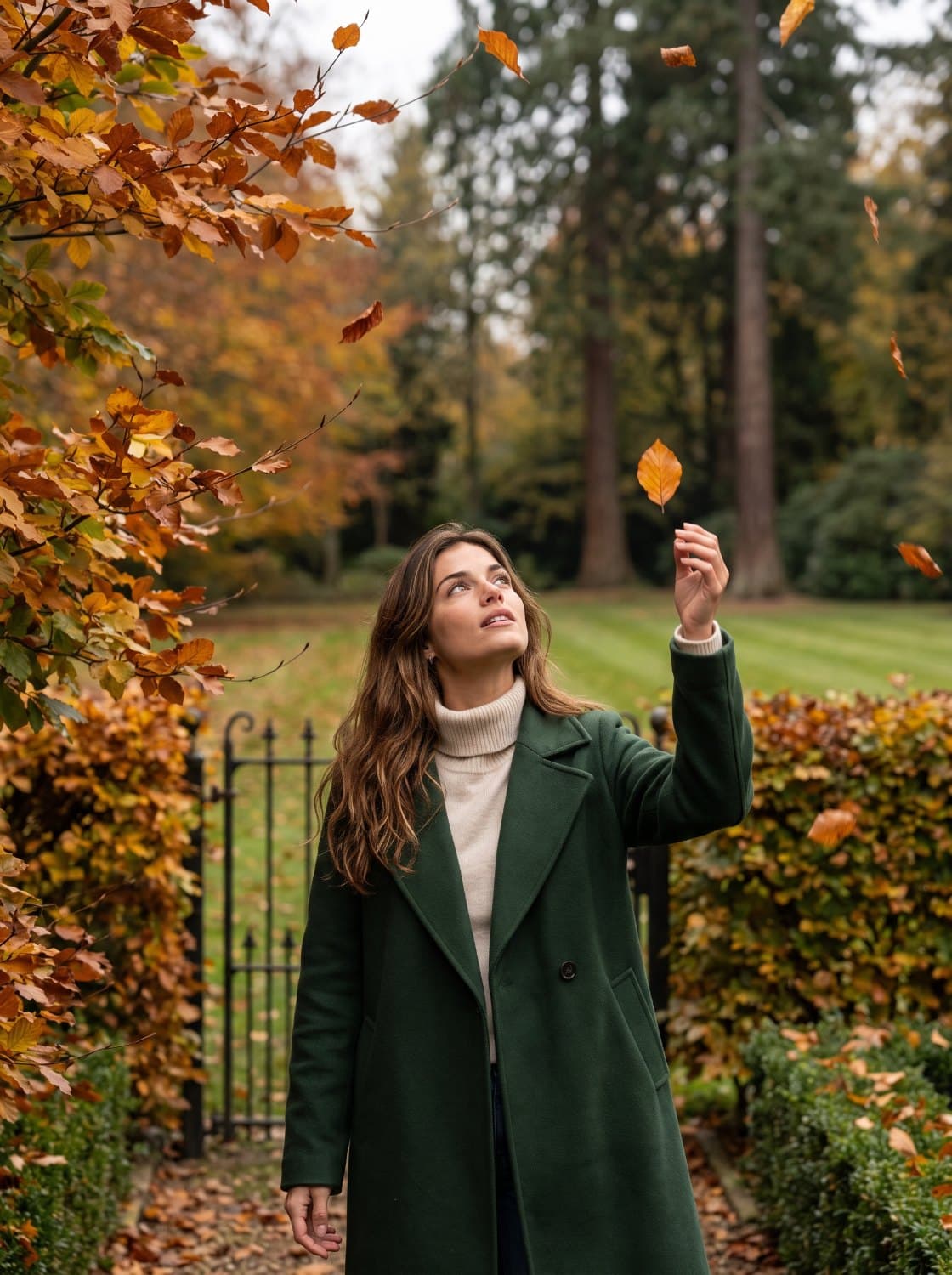 The same character reaching up to catch a falling leaf in an autumn garden
